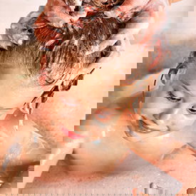 girl getting her hair washed for lice treatment girl getting her hair washed for lice treatment