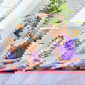 do not stress since we have the solution for head lice mom and 2 girls doing yoga to relax since we have the solution for head lice