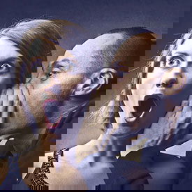 Secrets about head lice Man telling secret to woman about lice infestation