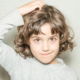 Girl itching her head because she has lice