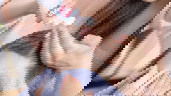 Parent using rid lice shampoo on child in Spring Grove Illinois