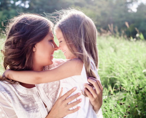 Mother and daughter are smiling together in Northern IL happy they do not have lice