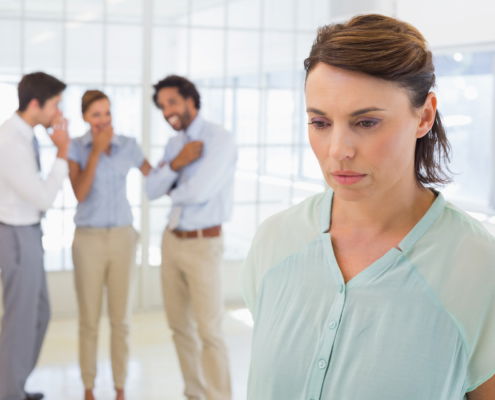 Woman being excluded at work because she has lice